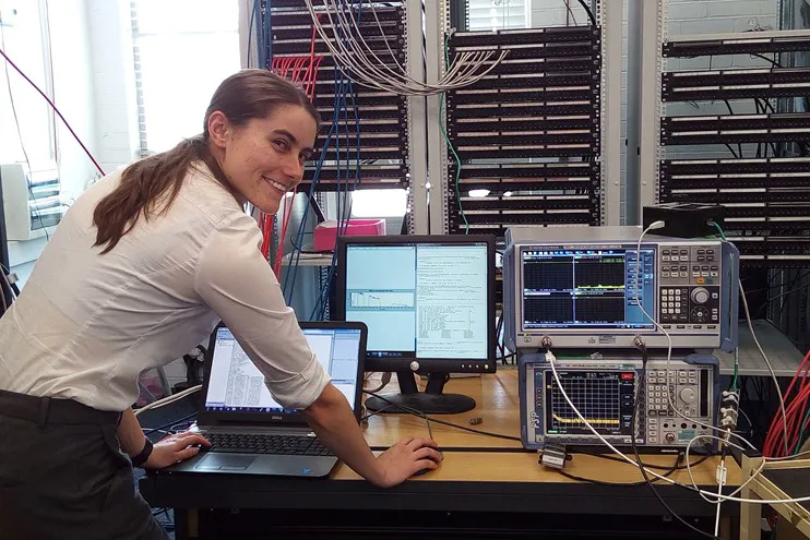 young woman engineer in front of IT data server