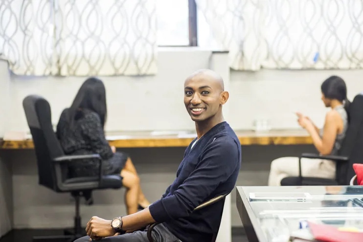 Smiling African American man sitting in an office